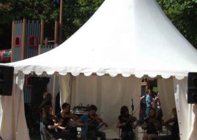 musicians playing in a marquee hire at a summer event in a bar
