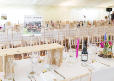 internal shot of tables and chairs inside a wedding marquee