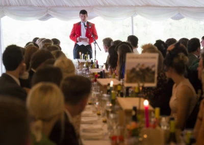 The Groom giving his speech in front of guests in a wedding marquee hire